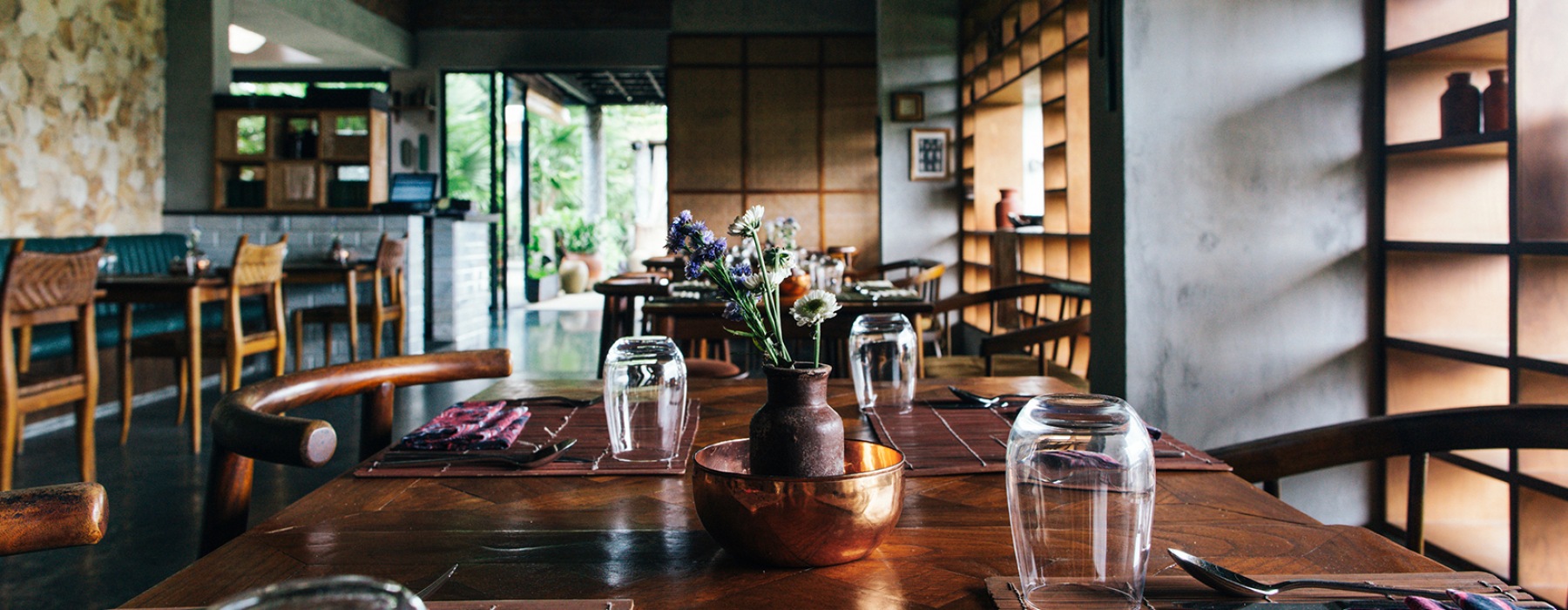 Neatly set table at a local restaurant with a calm, moody atmosphere