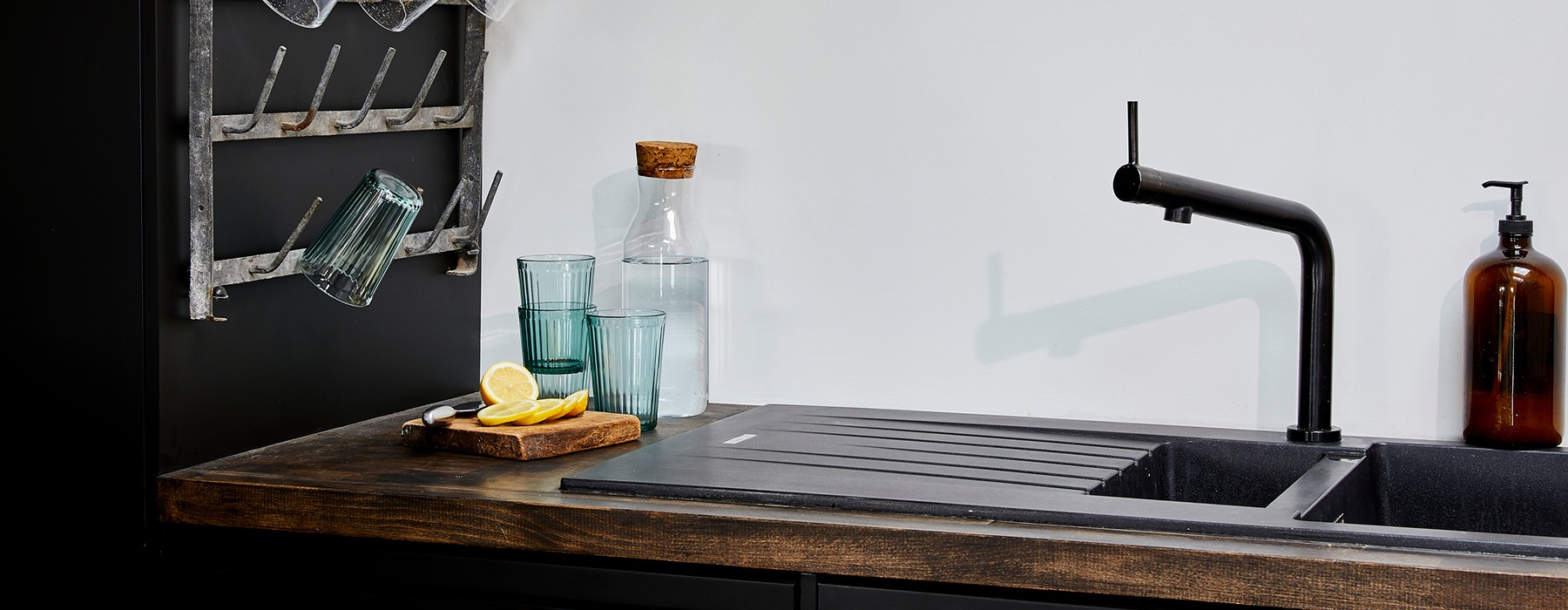 Close up of the modernly designed kitchen sink with butcher block countertops