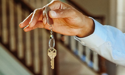 Person holding key